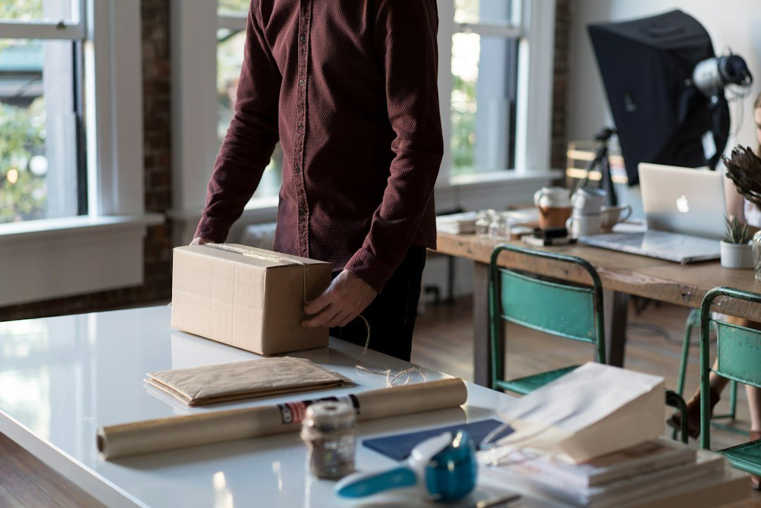 Office worker packing a box during a workplace relocation