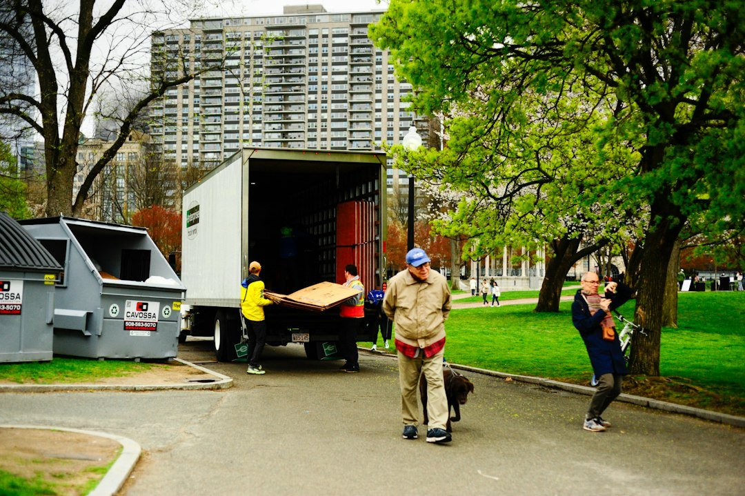 Removalists unloading furniture from a moving truck